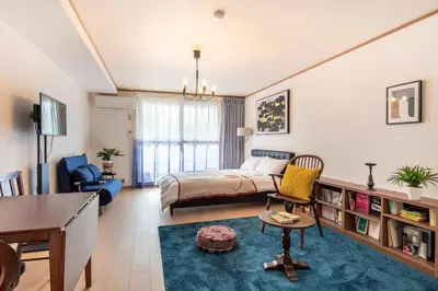 a bedroom with a bed and a desk in a room at DeLCCS\u543e\u59bb\u6a4bIII in Tokyo
