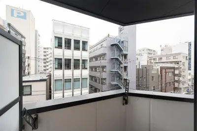 a view of a city skyline from a balcony at Grande\u68ee\u4e0b in Tokyo