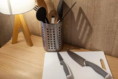a knife on a table next to a container of utensils at Rej\u30eb\u30d5\u30ec\u6075\u6bd4\u5bff in Tokyo