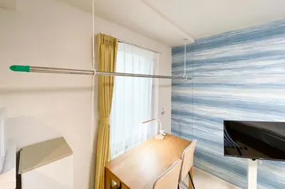 a bedroom with a desk and a bed and a window at \u30ce\u30be\u30df\u30aa\u30d7\u30ec\u30df\u30a2\u660e\u5927\u524d in Tokyo
