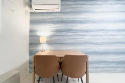 a dining room with a table and two chairs at \u30ce\u30be\u30df\u30aa\u30d7\u30ec\u30df\u30a2\u660e\u5927\u524d in Tokyo