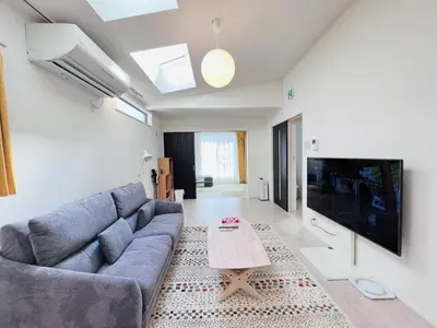 a living room with a couch and a tv at Tokyo QY TT0431 in Tokyo
