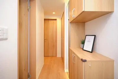 a room with a hallway with a wooden cabinet and a door at Seirai Vacation Rental Hatsudai - Vacation STAY 15951v in Tokyo