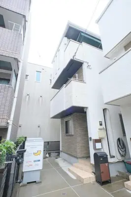 a large white building with a staircase on the side of it at Seirai Vacation Rental Hatsudai - Vacation STAY 15951v in Tokyo