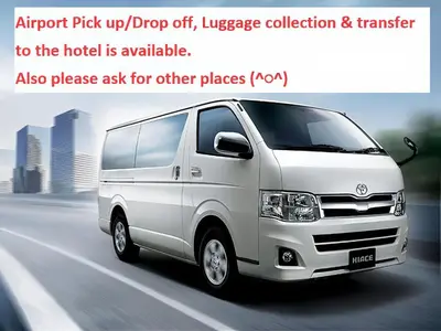 a white van driving down a city street at BISK PARK TOKYO - 4LDK&2Bath Spacious House - Easy Access to Asakusa, Skytree & Airport in Tokyo