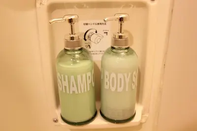 two bottles of soap in a box with words on it at LUANA ARAI in Tokyo