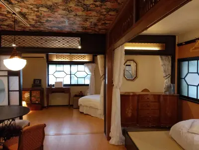 a room with a bedroom with a bed and windows at \u85e4\u7d2bFujiMurasaki Japanese classic House in Tokyo