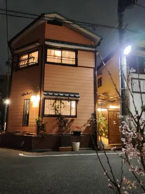 a house at night with lights in front of it at \u85e4\u7d2bFujiMurasaki Japanese classic House in Tokyo