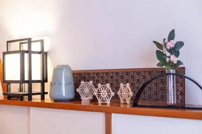 a shelf with a vase and some cups on it at \u30e1\u30c7\u30a3\u30a2\u30b3\u30f3\u30d7\u30ec\u30c3\u30af\u30b9\u30d3\u30eb in Tokyo