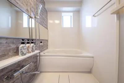 a bathroom with a white tub and a sink at \u30e1\u30c7\u30a3\u30a2\u30b3\u30f3\u30d7\u30ec\u30c3\u30af\u30b9\u30d3\u30eb in Tokyo