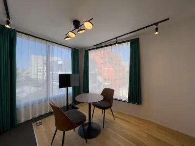 a room with a table and chairs in front of a window at \u30c8\u30ea\u30a2\u30b9540 in Tokyo