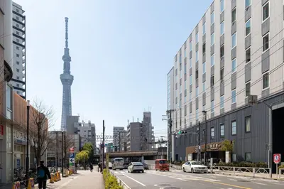 a city street with a view of the television tower at \u30c8\u30ea\u30a2\u30b9540 in Tokyo