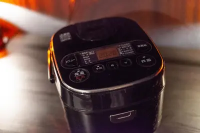 a close up of a cell phone sitting on a table at \u30b5\u30f3\u30d1\u30ec\u30b9\u897f\u65b0\u5bbf in Tokyo