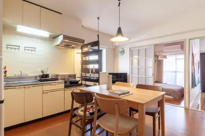 a kitchen and dining room with a table and chairs at \u30b7\u30e3\u30c8\u30ec\u897f\u5927\u4e95 in Tokyo