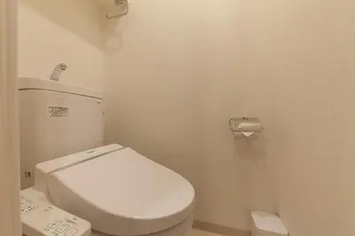 a bathroom with a white toilet in a stall at Tokyo Sunshine Tower in Tokyo