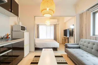 a small apartment with a kitchen and a living room at Tokyo Sunshine Tower in Tokyo