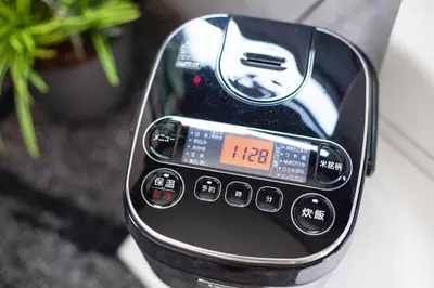 a close up of a cell phone sitting on a table at \u690e\u540d\u753a\u30cf\u30a6\u30b9 in Tokyo