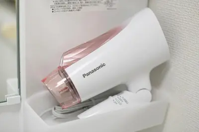 a white sewing machine sitting inside of a refrigerator at \u5e61\u30f6\u8c373\u4e01\u76ee\u6238\u5efa in Tokyo
