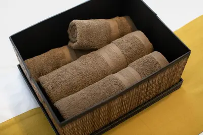 a box filled with towels and towels on a table at \u5e61\u30f6\u8c373\u4e01\u76ee\u6238\u5efa in Tokyo