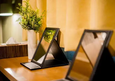two mirrors sitting on a table with a vase at IKIDANE Residentila Hotel Komagome - Vacation STAY 17962v in Tokyo