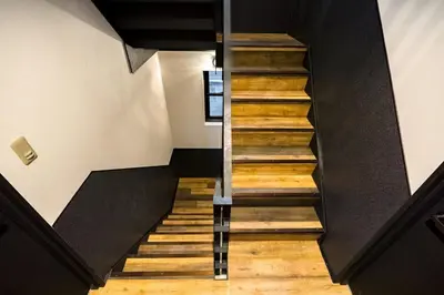 a staircase in a house with wooden floors at IKIDANE Residentila Hotel Komagome - Vacation STAY 17962v in Tokyo