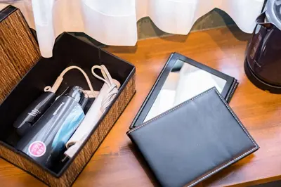 two baskets with a lighter and a cell phone on a table at IKIDANE Residentila Hotel Komagome - Vacation STAY 17962v in Tokyo