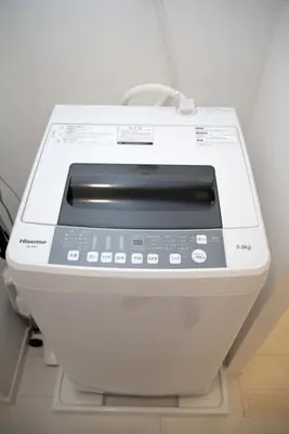 a close up of a washing machine in a room at \u30d7\u30ec\u30df\u30a2\u30e0\u30b3\u30fc\u30c8\u897f\u6c60\u888b in Tokyo