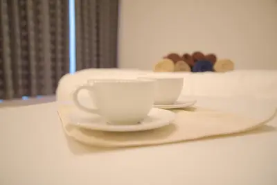 two cups and saucers sitting on a table at \u30d7\u30ec\u30df\u30a2\u30e0\u30b3\u30fc\u30c8\u897f\u6c60\u888b in Tokyo