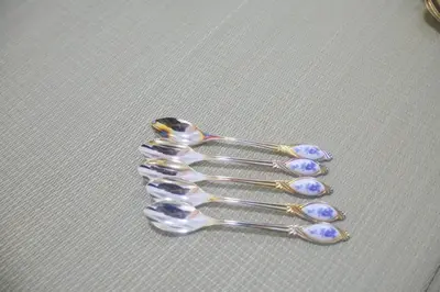 a silver spoon with purpleestones on top of it at \u82b1\u4e43\u90f7 \u8d64\u7fbd in Tokyo