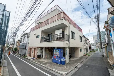 a building on the side of a street at Ikebukuro East Exit Queen Bed Room in Tokyo