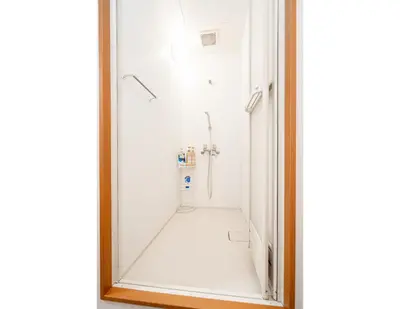 a mirror in a bathroom with a shower at Ikebukuro East Exit Queen Bed Room in Tokyo