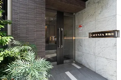 an entrance to a building with a sign on it at Lafesta\u6771\u99d2\u5f62 in Tokyo