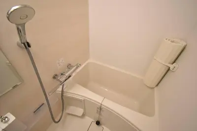 a white shower in a bathroom with a sink at \u6771\u99d2\u5f62101 in Tokyo