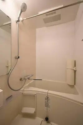a white bathroom with a shower and a toilet at \u6771\u99d2\u5f62101 in Tokyo