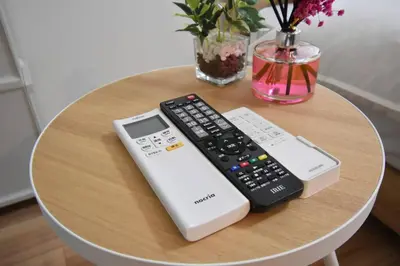 a table with two remotes and a remote control at \u6771\u99d2\u5f62102 in Tokyo