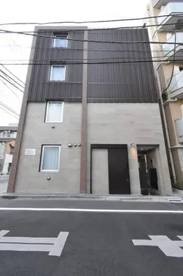 a building on the side of a street at \u6771\u99d2\u5f62102 in Tokyo