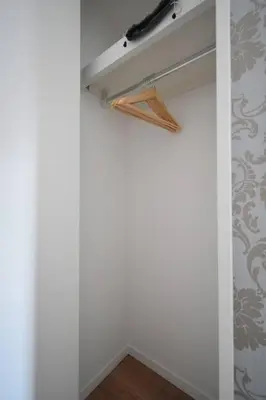 a closet with a hanger and aabinet at \u6771\u99d2\u5f62203 in Tokyo