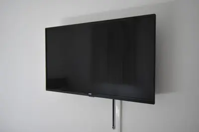 a flat screen tv sitting on a stand at \u6771\u99d2\u5f62203 in Tokyo