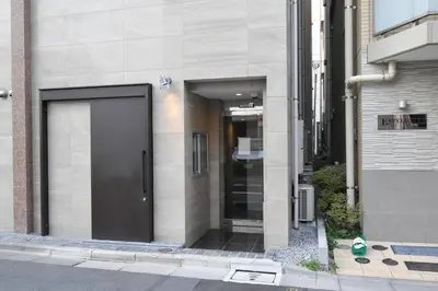 a building with a door on the side of a street at \u6771\u99d2\u5f62301 in Tokyo
