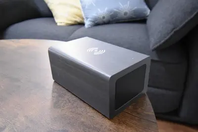 a speaker sitting on a table in front of a couch at \u6771\u99d2\u5f62301 in Tokyo