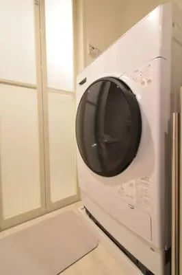a microwave oven sitting on top of a kitchen at \u6771\u99d2\u5f62302 in Tokyo