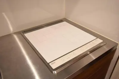 a digital scale in a corner of a refrigerator at \u6771\u99d2\u5f62302 in Tokyo