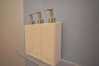 a row of three knives in a box on a shelf at \u6771\u99d2\u5f62401 in Tokyo