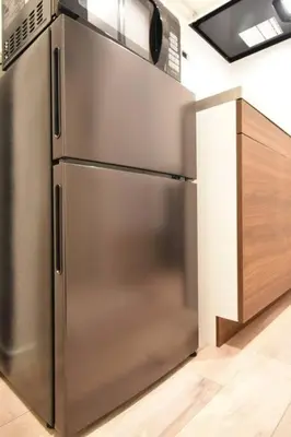 a stainless steel refrigerator in a kitchen at \u6771\u99d2\u5f62401 in Tokyo
