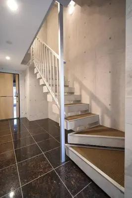 a staircase in a house with a tiled floor at \u6771\u99d2\u5f62403 in Tokyo