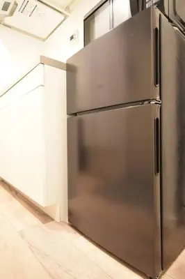 a stainless steel refrigerator in a kitchen at \u6771\u99d2\u5f62403 in Tokyo