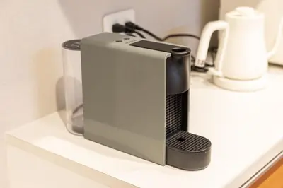 a black and silver appliance sitting on a shelf at SUA HOTEL Hikifune in Tokyo