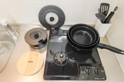 a pot sitting on top of a stove at LIVION V Hatagaya by Tranova in Tokyo