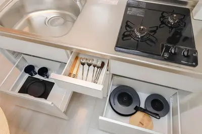 a kitchen with a sink and a stove at LIVION V Hatagaya by Tranova in Tokyo