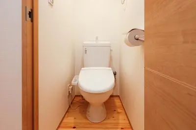 a bathroom with a toilet in a small room at Nakano Five by Tranova in Tokyo